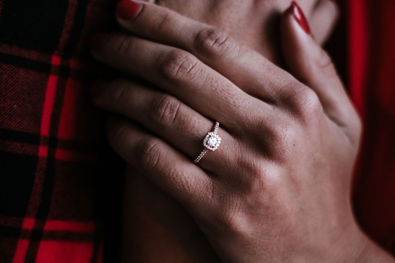 Woman wearing halo engagement ring