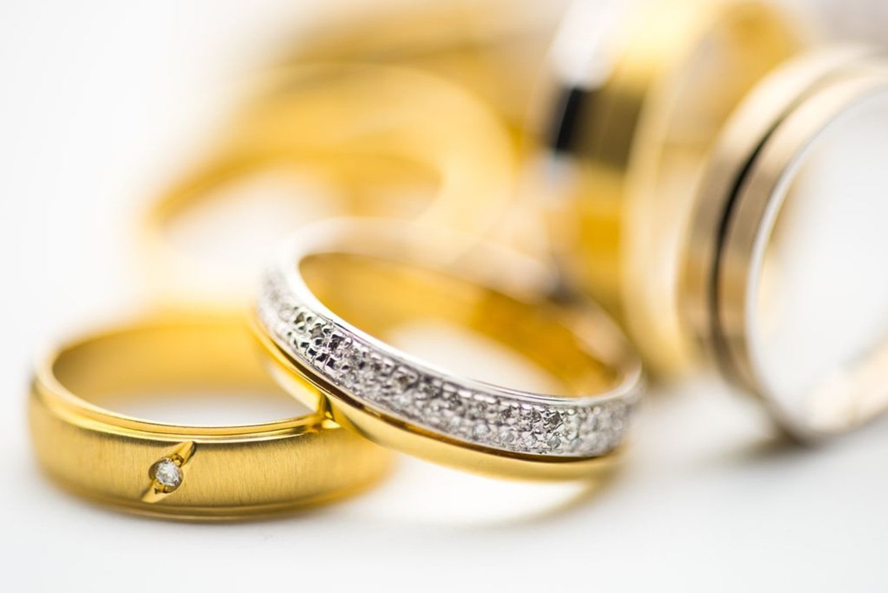 several gold rings including an eternity wedding band
