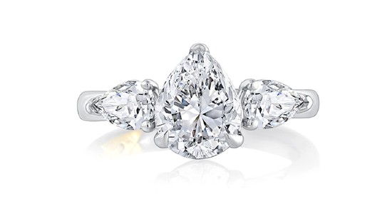 three stone, silver engagement ring with three pear shaped diamonds
