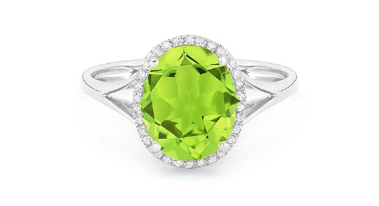 a silver, peridot cocktail ring with a split band and diamond halo